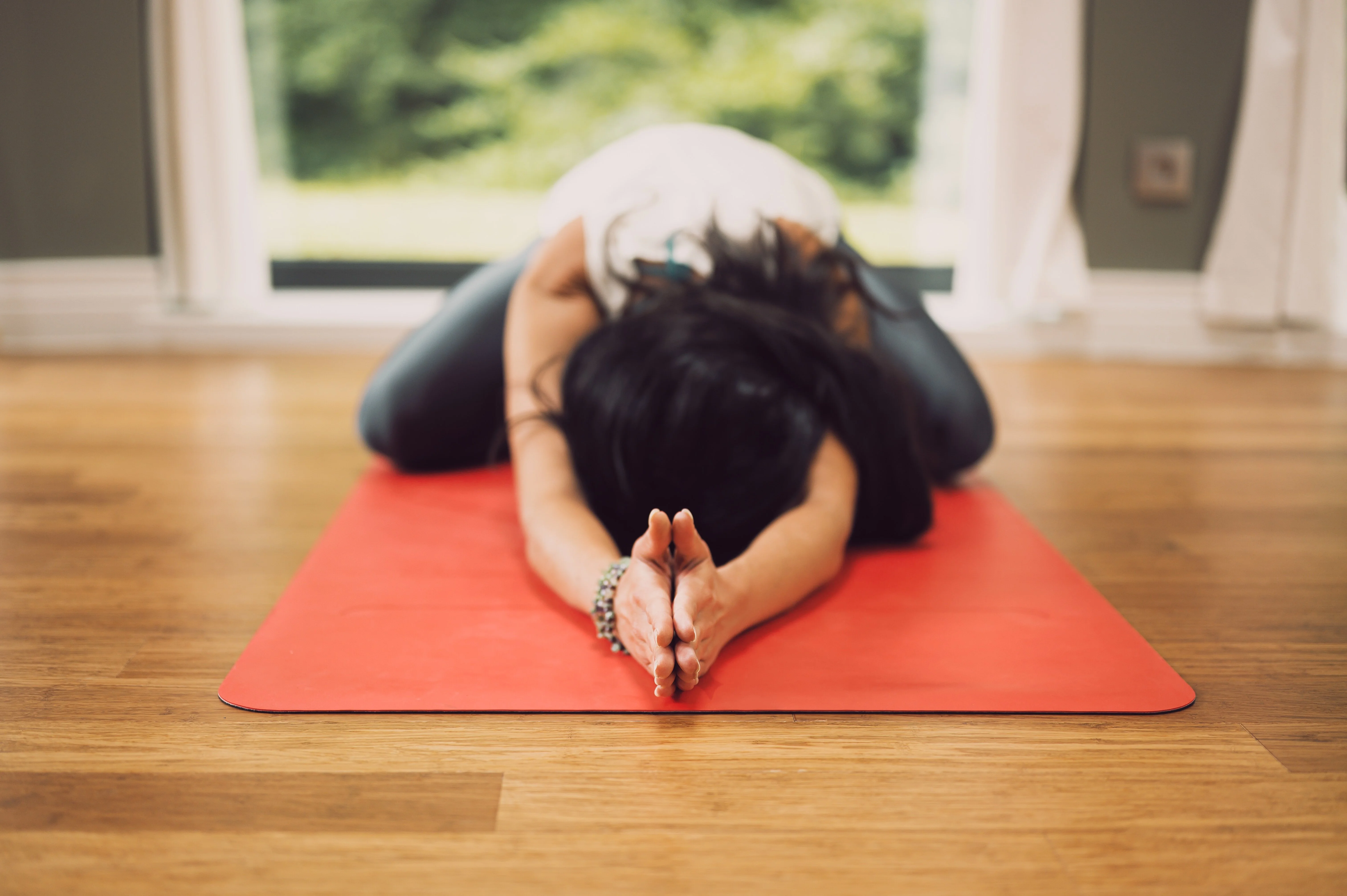 Yoga mats and practitioner in Bristol yoga class